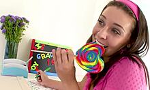 Gracie Glam, a young and adorable girl, eagerly gives a blowjob while handling a massive cock in a POV style. She swallows the cum on the end, resembling a tiny lollipop. This video is brought to you by Monster Cock, Big Cock, and Huge tags.